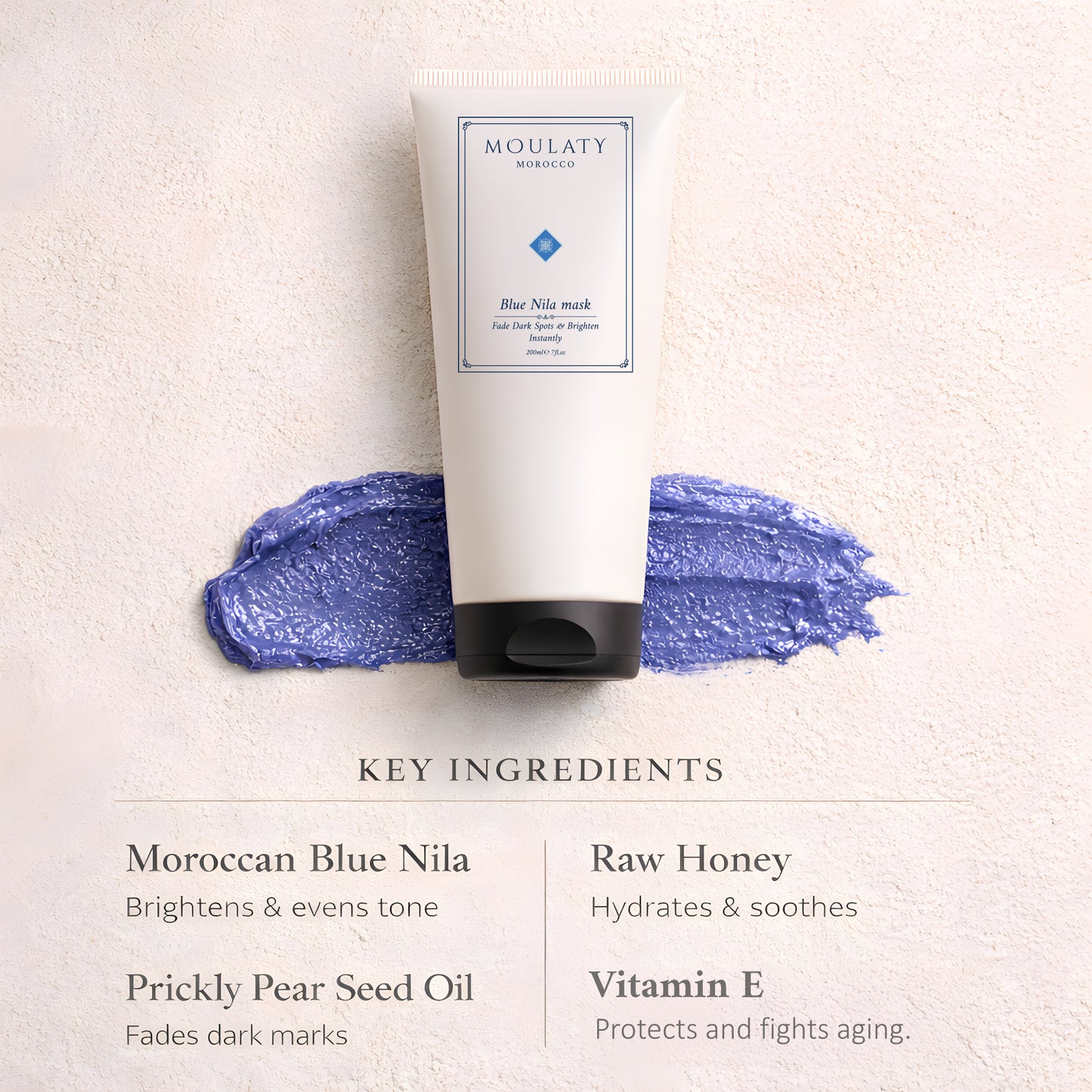 Blue Nila face mask tube on textured surface with blue mask swipe and listed key ingredients.