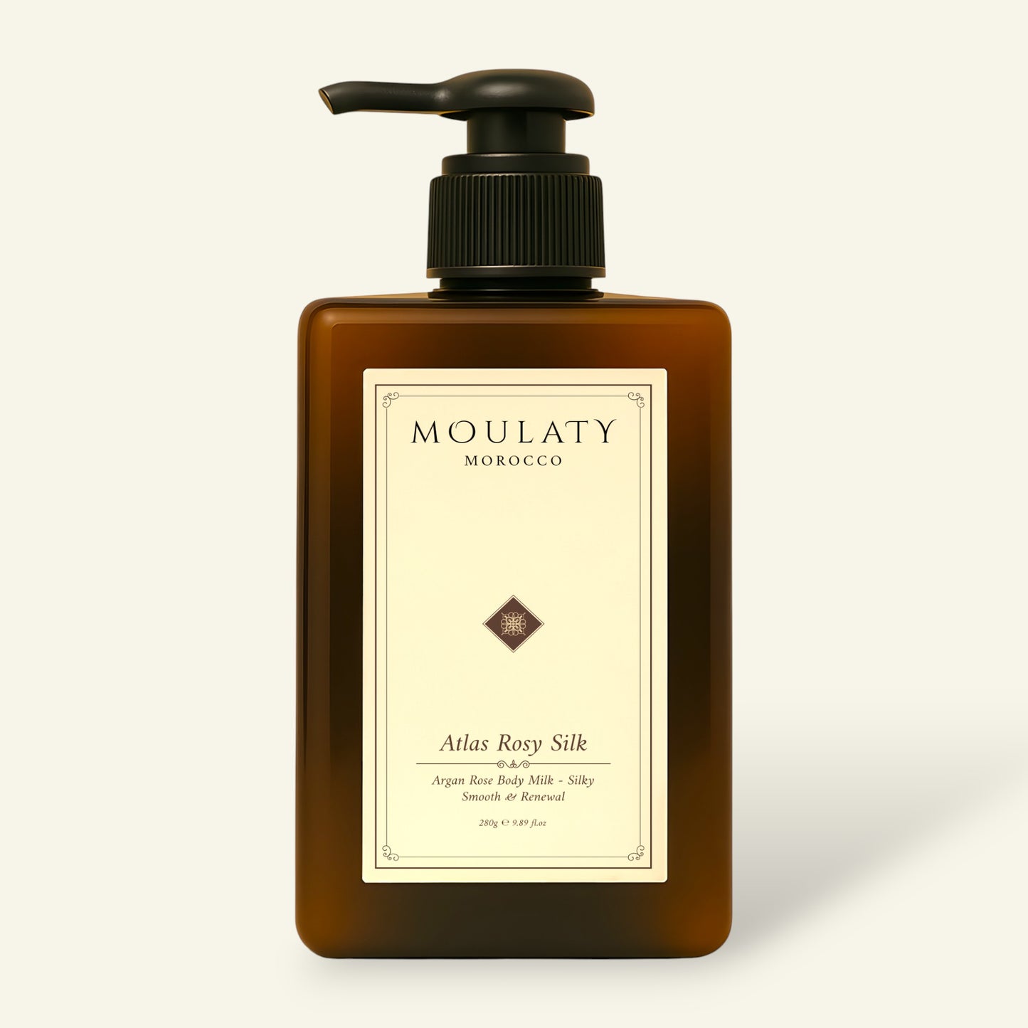 Amber pump bottle of Atlas Rosy Silk argan rose body milk against a beige background.