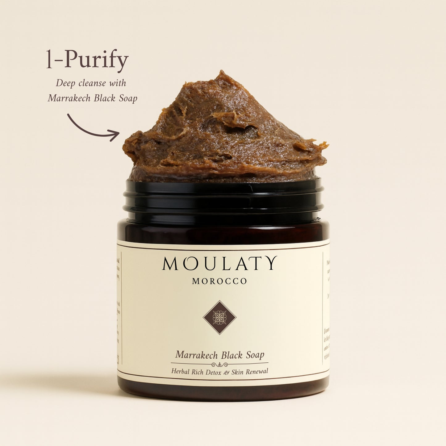 Jar of Marrakech Black Soap with herbal detox skincare label and natural paste texture.
