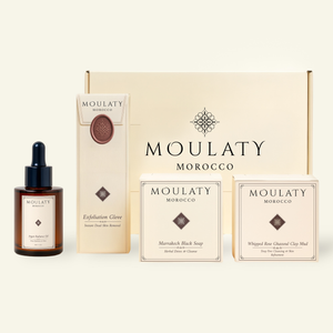Moroccan hammam spa set with argan oil, exfoliation glove, black soap, and ghassoul clay mud.
