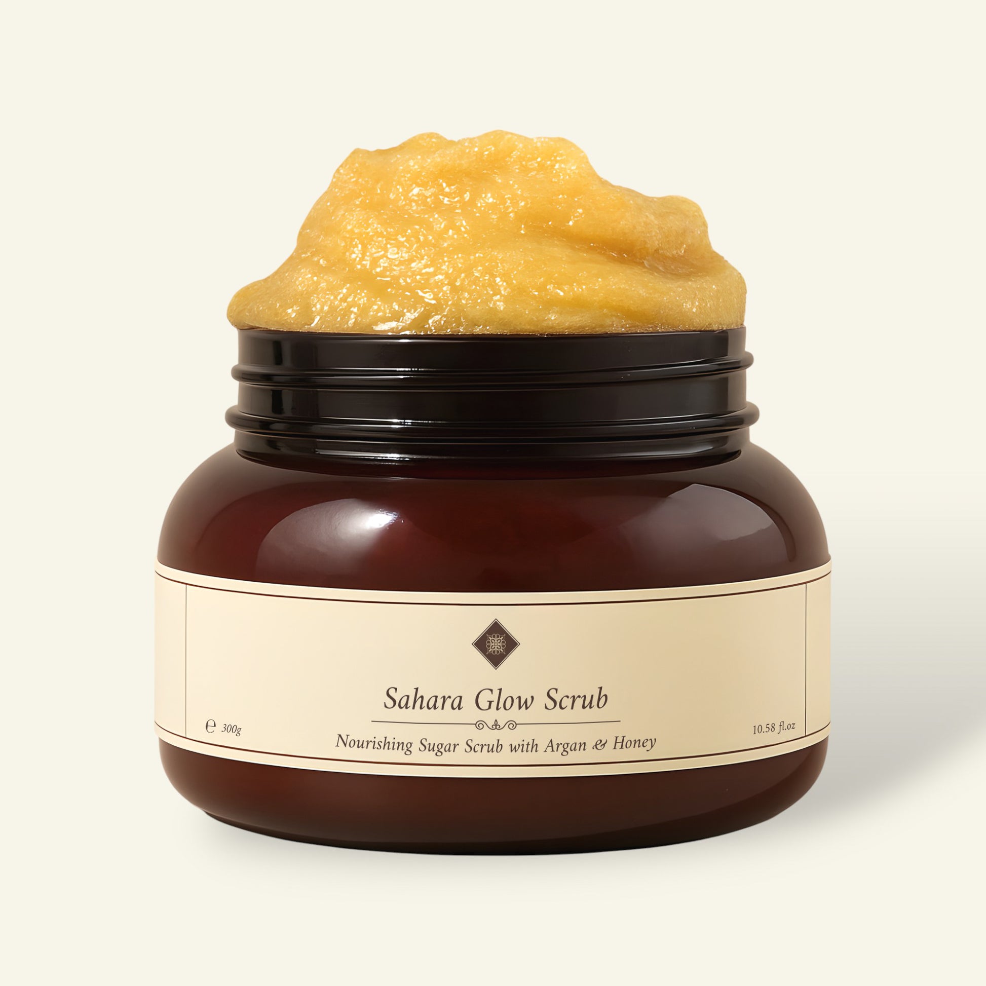 Sahara Glow Scrub jar with sugar scrub, featuring argan oil and honey for nourishing skincare.