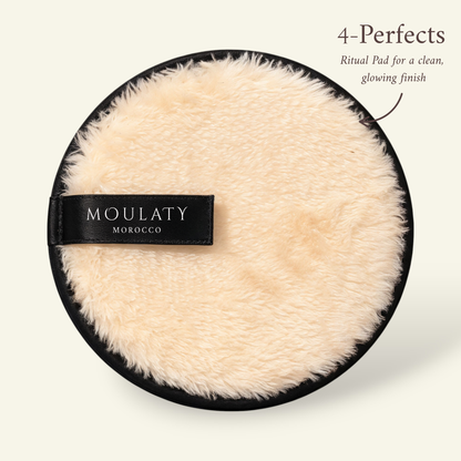Beige fluffy ritual cleansing pad with black trim and label, ideal for glowing skincare