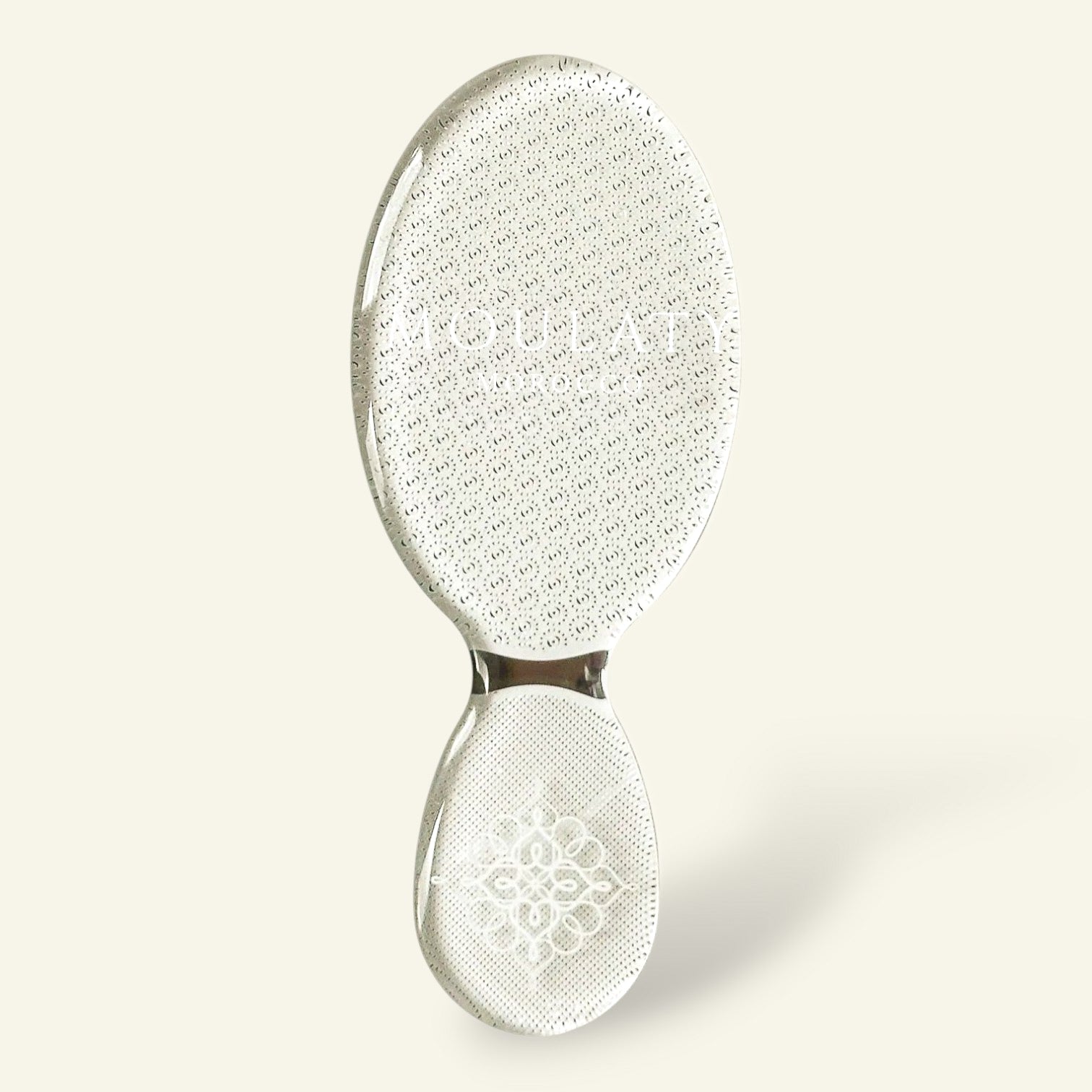 Moroccan nano glass foot file exfoliator with textured surface on light background